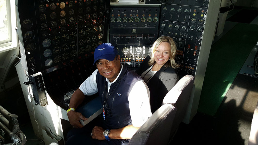 owners in the cockpit of a plane